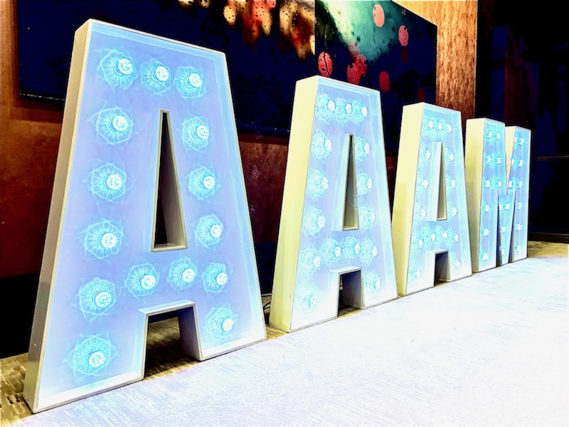 AAAM large lit-up block letter signage at the Association of African American Museums conference in Miami
